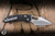 Microtech/Borka Blades Stitch Ram-LOK Manual Folder Knife Black Fluted G10 3.75" M390 Stonewash Serrated 169RL-11FLGTBK	