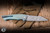 Herman Knives Ovium II Folder Knife Blue/Yellow Titanium/Black Timascus Accents 4.06" Damasteel Mirror Polish 0197
