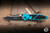 Preowned-Microtech Socom Elite Manual Folding Knife Turquoise Aluminum 4" M390 Black 160-1TQ