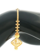 Reverse view of the baby bracelet highlighting the fine gold chain, symmetrical bead accents, textured oval element, and decorative centerpiece.