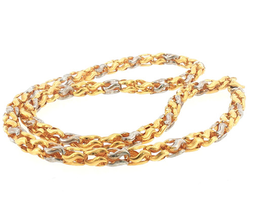Full laid-down view of the 22-inch necklace showcasing the continuous woven wave-link design, polished yellow-gold finish, and contrasting white-tone accents throughout the chain.
Alt Text: 22 inch 22K two-tone yellow gold woven link chain necklace full view