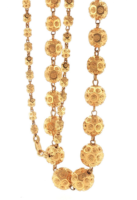 Front hanging view of the 22K yellow gold necklace showcasing large graduated spherical beads connected by gold links. Each dimensional bead features intricate circular medallion-like motifs and textured detailing that creates a richly ornamental appearance.