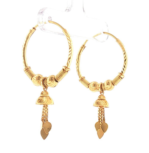 Side view of 22K yellow gold dangle earrings showcasing textured hoop frames, coiled gold accents, decorative drops, and delicate dangling leaf-shaped charms.