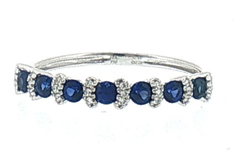Front view of an 18K white gold stackable ring featuring round royal blue sapphires accented by sparkling diamond-set curved motifs, with 0.06 ct total diamond weight.