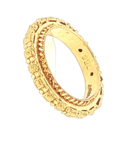 Angled view of a 22KT yellow gold textured band ring highlighting its raised geometric motifs, intricate decorative borders, and polished interior, 5.3 grams.