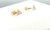 Side profile of 14K gold triangle diamond stud earrings with pavé-set diamonds