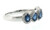 Angled side view of the royal blue sapphire and diamond ring, highlighting the five oval sapphire settings, delicate diamond halo detailing, and polished 18KT white gold band.