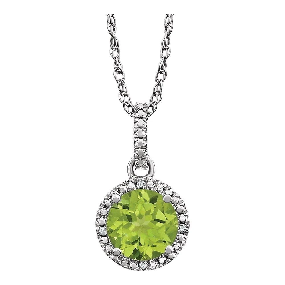 Round peridot pendant surrounded by a pavé diamond halo in 14K white gold, the August birthstone, at Karat 22 Jewelers Houston