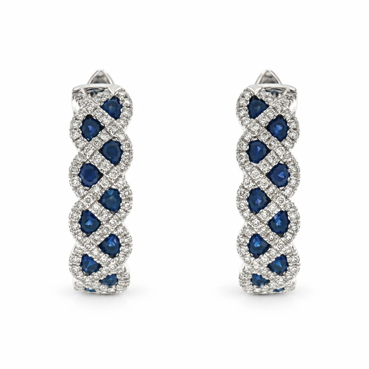 Royal blue sapphire and diamond crisscross hoop earrings in 18K white gold, front view