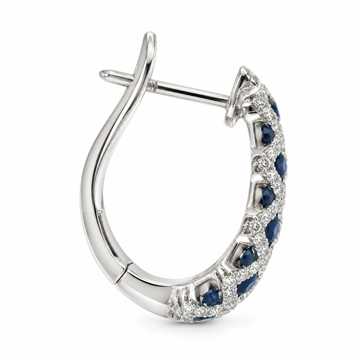 Single royal blue sapphire and diamond crisscross hoop earring in 18K white gold, profile view with the hinged latch open