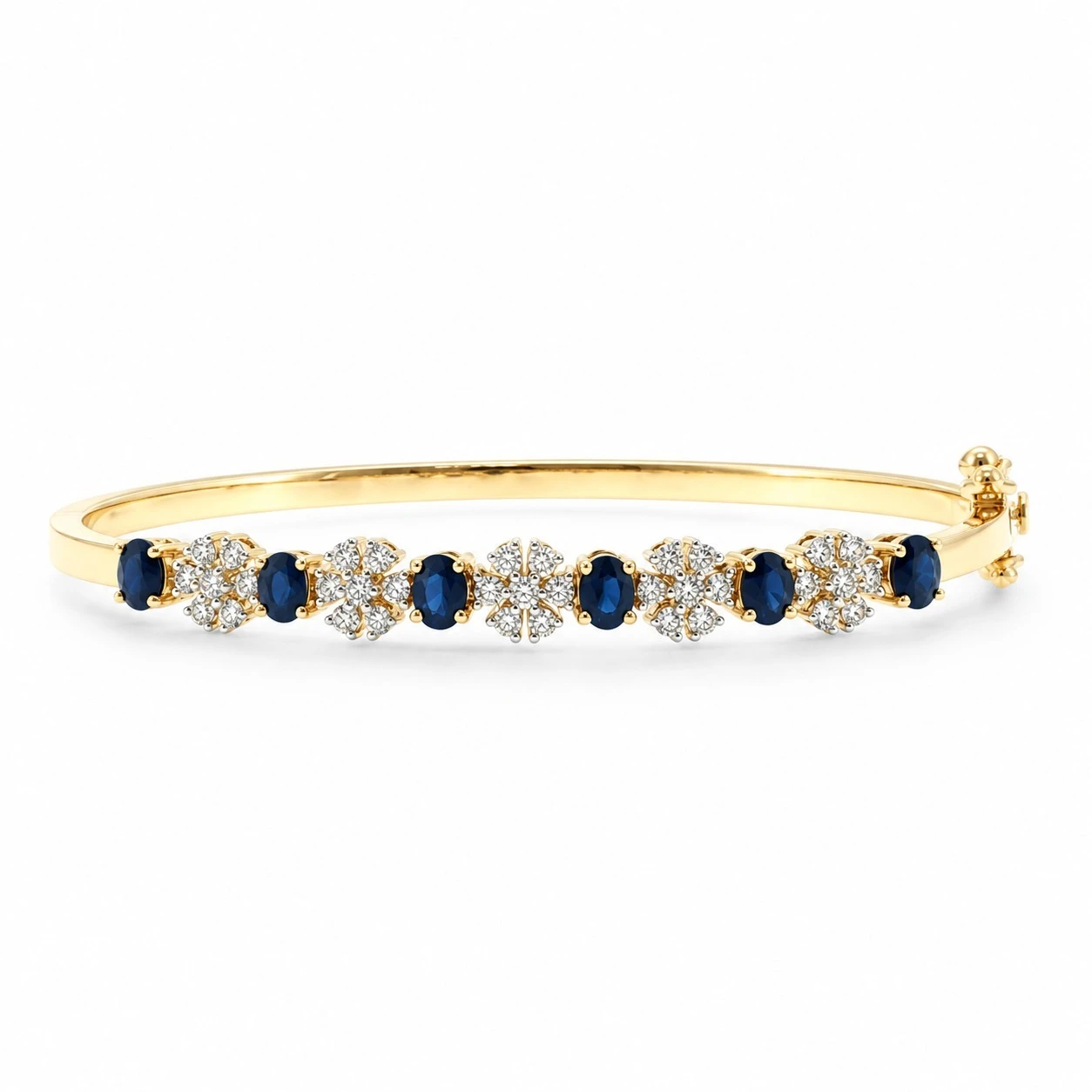 Alternating blue sapphire and diamond floral cluster bangle bracelet in 18K yellow gold