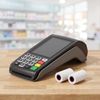 Ingenico Desk 5000 terminal with thermal paper rolls on pharmacy counter