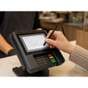 Customer signing on VeriFone MX terminal with stylus pen at retail counter