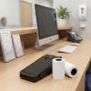 Ingenico AXIUM DX4000 terminal with thermal paper rolls on pharmacy counter