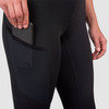 Close up of woman wearing Ultimate Direction Women's Hydro Tight, side view, showing woman putting phone into thigh pocket