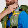 Close up of man placing water bottle in pocket of Ultimate Direction Fastpack 40