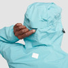 Close up of Ultimate Direction Women's Deluge Jacket, showing woman pulling cinch cord on hood