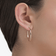 Small solo diamond sunrise hoops - on model