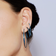Denim blue diamond linear tennis earrings - on model