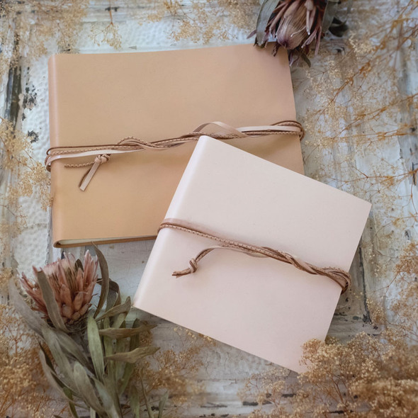 Leather Book with Tri-Leather Strap - hand braided tri - nude in back, snow in front- by Blue Sky Papers Leather Book with Tri-Leather Strap - hand braided tri - nude in back, snow in front- by Blue Sky Papers
