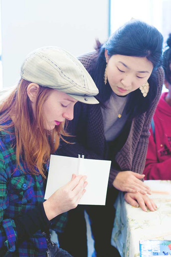 Blue Sky Papers employee helps out at bookbinding workshop