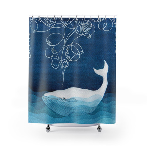 Teal blue watercolor shower curtain featuring whales and other sea creatures