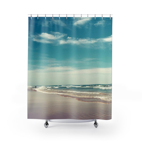 Colorful swimmer shower curtain with beach and ocean scenes