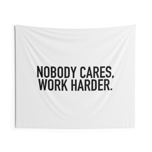 Motivational tapestry with 'Nobody cares, work harder' quote
