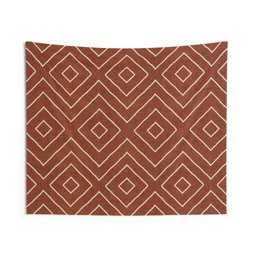 Rust-colored tapestry with bohemian geometric pattern