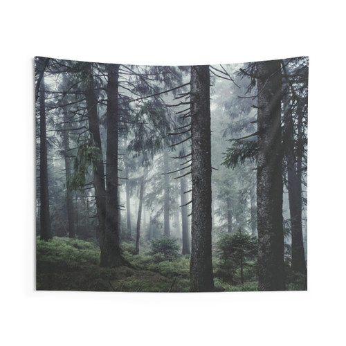 Misty forest tapestry with trees covered in blue fog