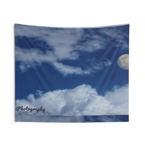 Bright sky with scattered clouds and a prominent moon tapestry