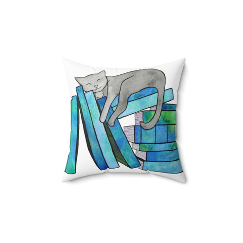Blue pillow with book and cat graphic for book lovers