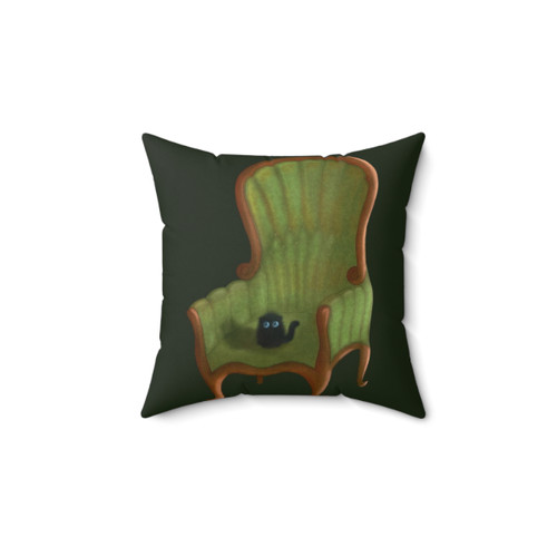 Cute small cat on a chair pillow