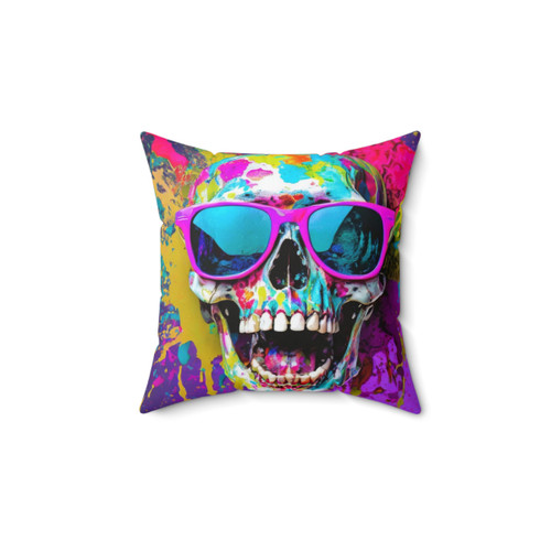 Colorful skull-themed pillow with sunglasses and paint splatter effect