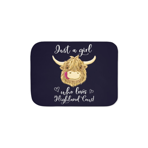 A cozy Scottish Highland Cow Sherpa Blanket