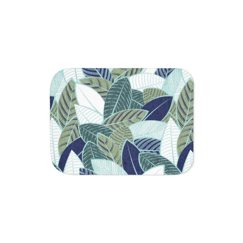 Sherpa blanket with a leaf design in navy blue, sage green, and mint