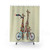 Colorful and whimsical shower curtain with giraffes riding tandem bicycles