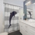 Navy blue dolphin jumping on silver gray striped shower curtain
