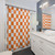 Checkered orange and white shower curtain