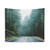Foggy forest adventure tapestry with fir trees and mountains