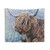 Highland cow in a frosty winter scene tapestry