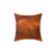 Copper metallic throw pillow with orange accent