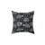 Decorative pillow with a repeating raccoon pattern