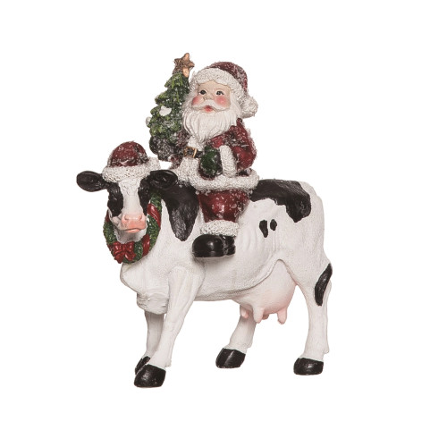 Santa Riding Cow Figurine