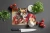 Cozy Christmas Chihuahua Glass Cutting Board