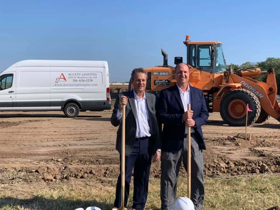 Pat and Paul Graf holding shovels at the Accent Lighting groundbreaking