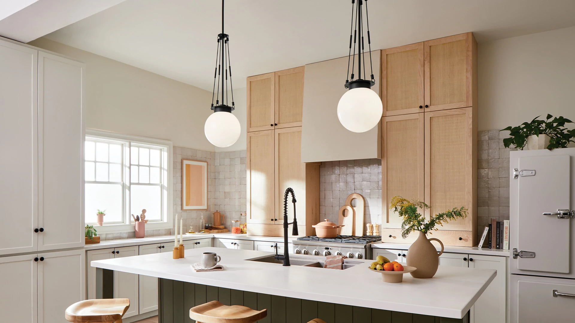 Globe pendant lights above a kitchen island