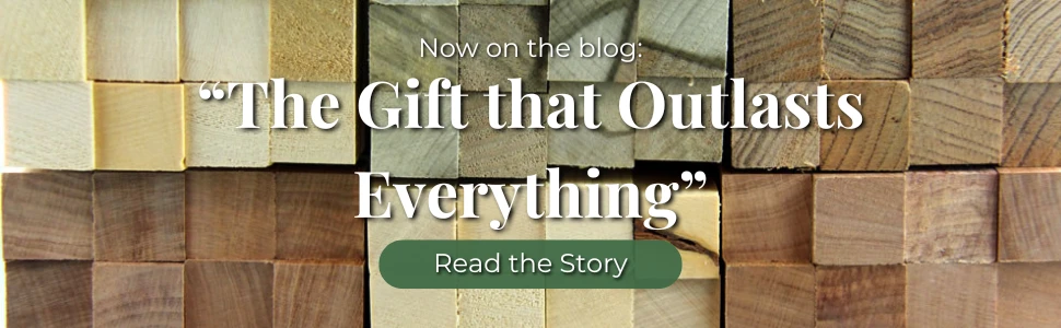 A neat arrangement of timber blanks in various species and sizes stacked together, showing a range of natural wood tones from pale cream to warm golden brown. Text overlay reads "The Gift that Outlasts Everything" with a Read the Story button. Tas Turning Supplies blog hero image