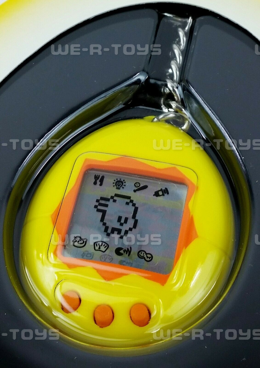 Tamagotchi Virtual Reality Pet 1996 - 1997 Bandai Yellow & Orange