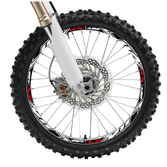 A dirt bike wheel with the rim covered in graphics.